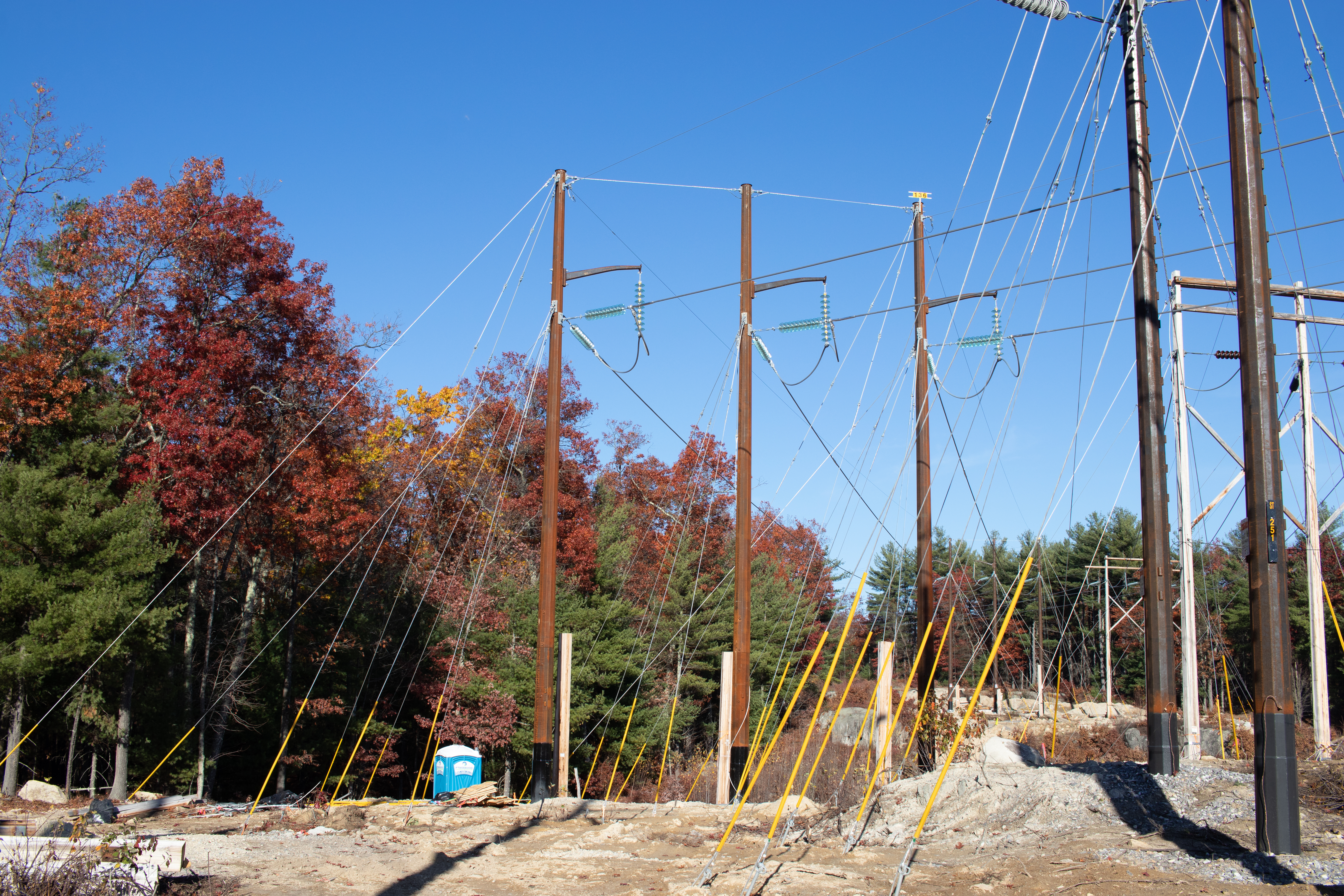 Harlan Electric’s project involved the replacement of 252 old poles situated along the Granite State’s signature rocky terrain. Photo by Harlan Electric Co.