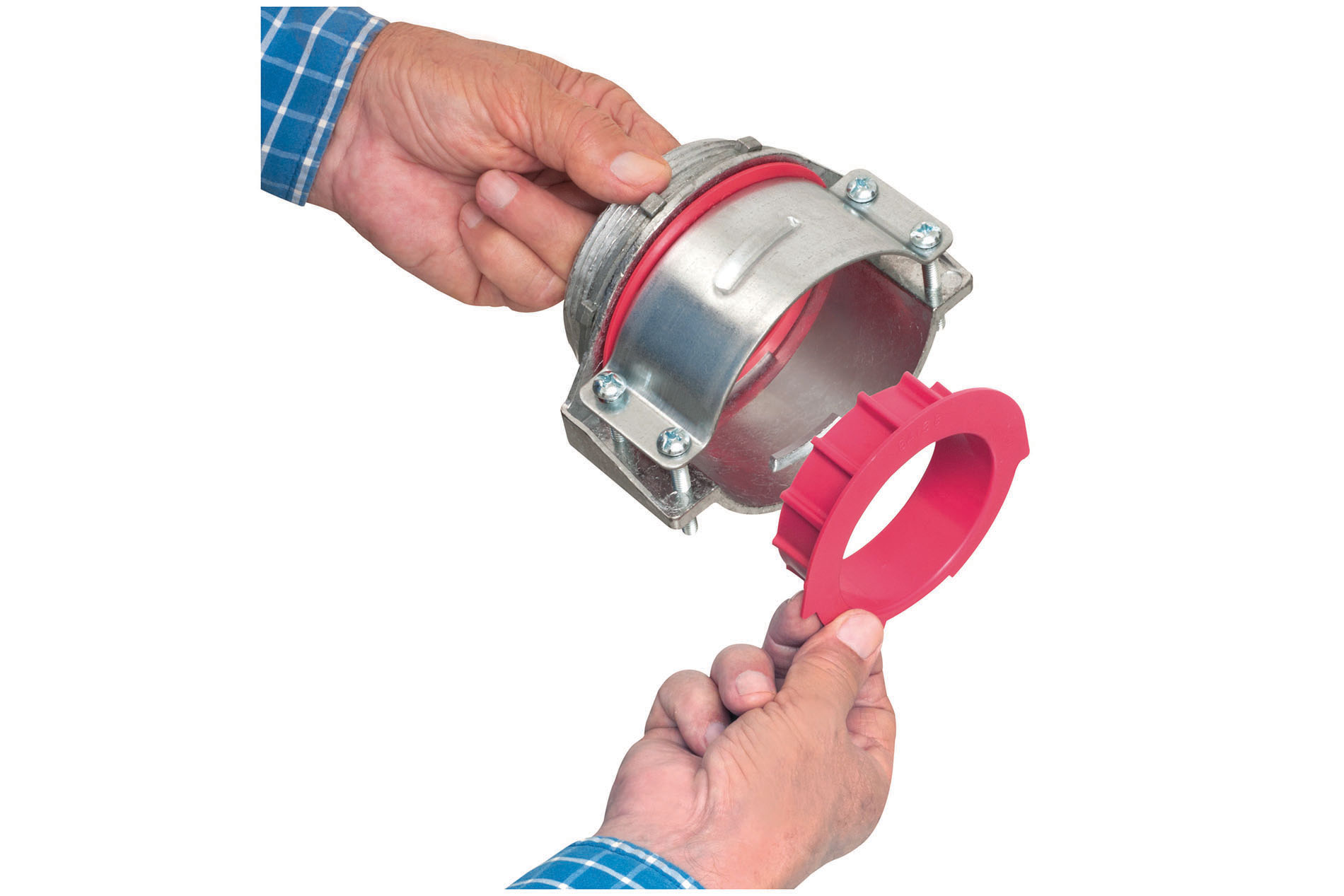 Hands hold out a red and silver cable fitting. Image by Arlington Industries.