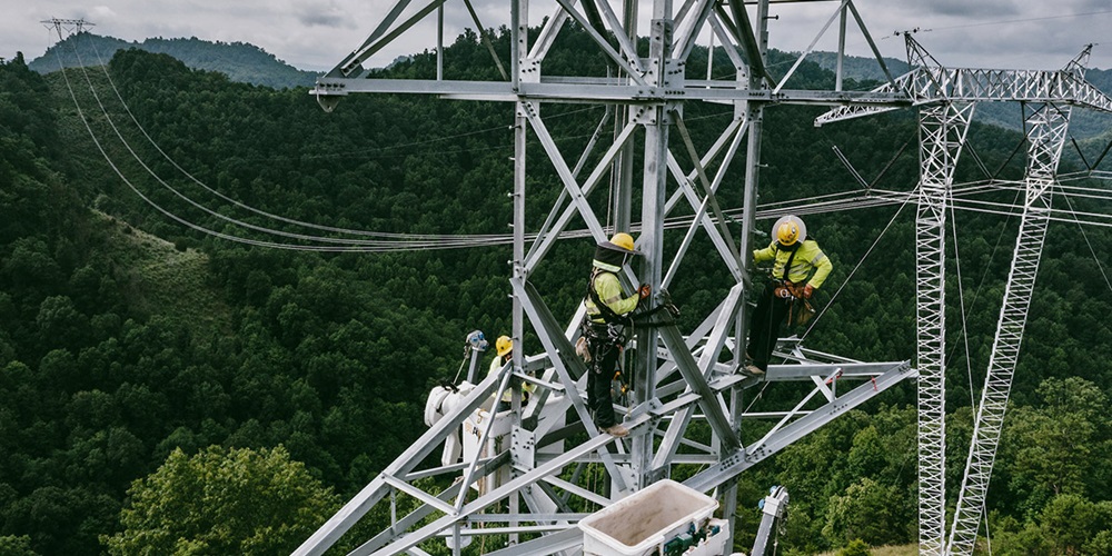 workers on transmission lines