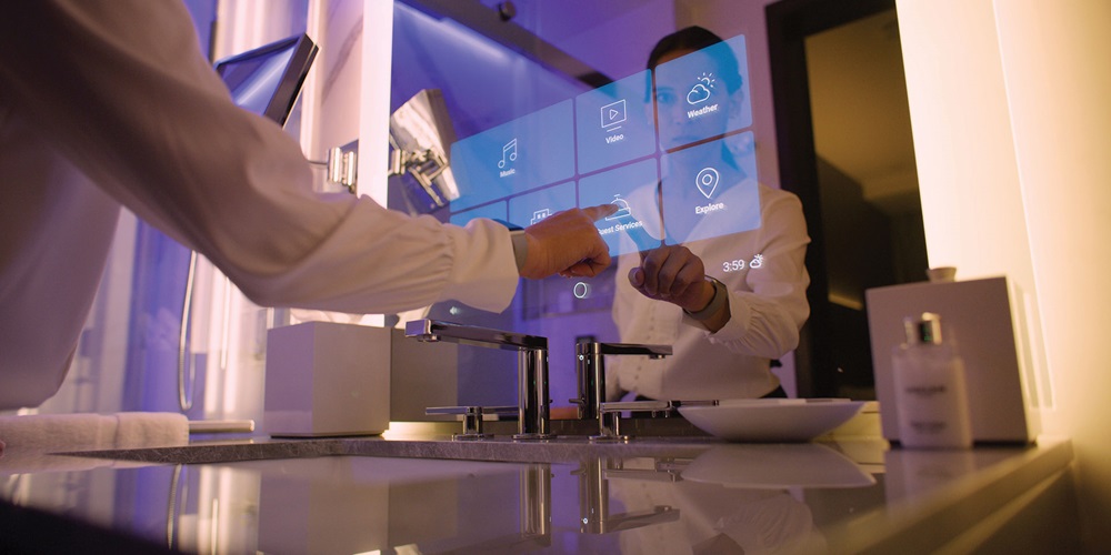 A guest interacts with the smart mirror inside a bathroom at The Sinclair hotel. | Sinclair Holdings LLC