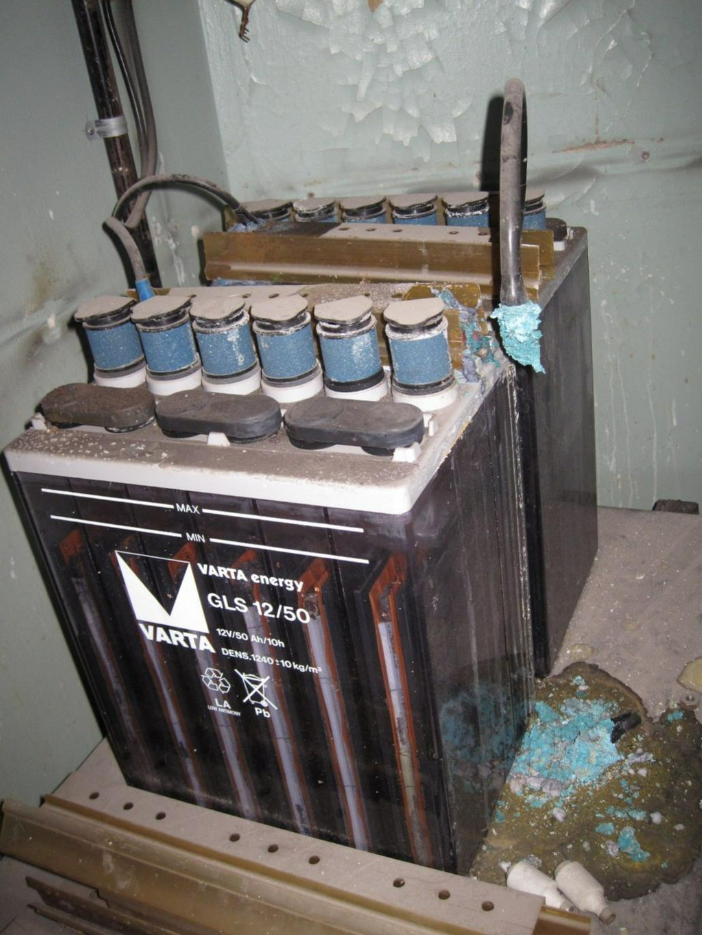 Leaking battery with a Varta energy logo.