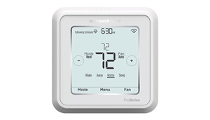 Gray and white thermostat with digital readout. Image by Resideo.