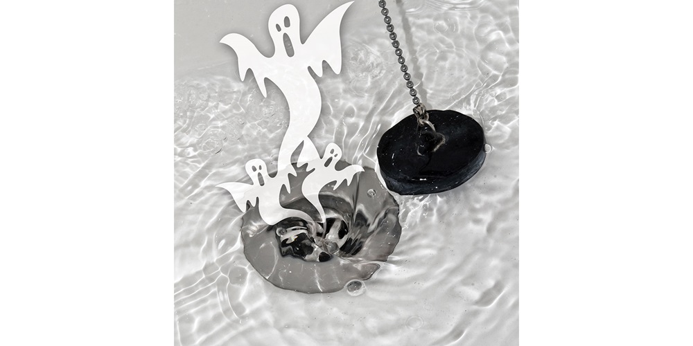 Cartoon ghosts float out of a sink drain
