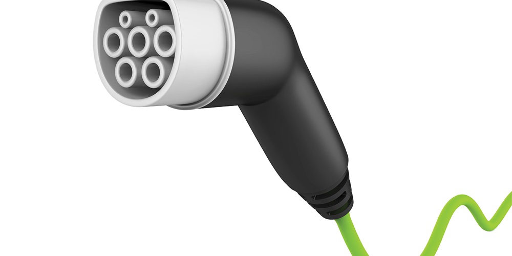 A charging plug for an electric vehicle | Shutterstock / Nerthuz