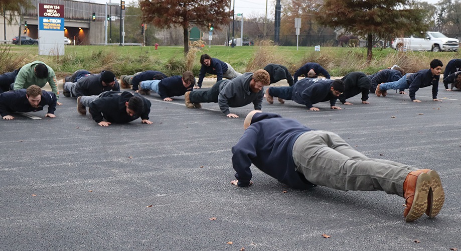 Third-year apprentices start their class day with a half hour of walking, calisthenics and core-strengthening yoga at the IBEW-NECA Technical Institute in Alsip, Ill.