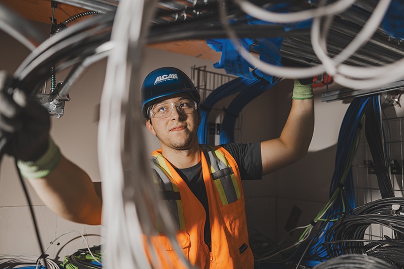 An Alcan Electrical communications team member installs the core infrastructure for the Solid Waste Services Central Transfer Station project in Anchorage.