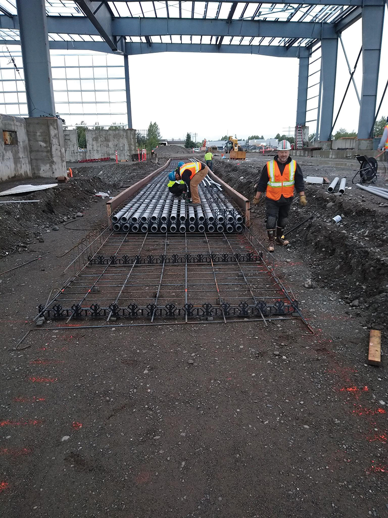 An Alcan Electrical wireman works on a duct bank at the Central Transfer Station project prior to the concrete pour. | Credit: ALCAN ELECTRICAL & ENGINEERING INC.