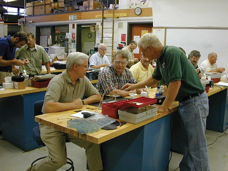 FOA co-founder John Highhouse shows how to effectively teach fiber optics during a train-the-trainer course.