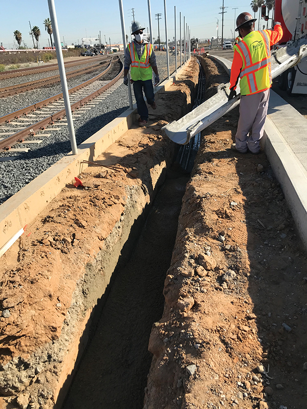Elecnor Belco team pours concrete to protect the newly installed electrical duct bank infrastructure. Photo by Elecnor Belco Electric Inc.