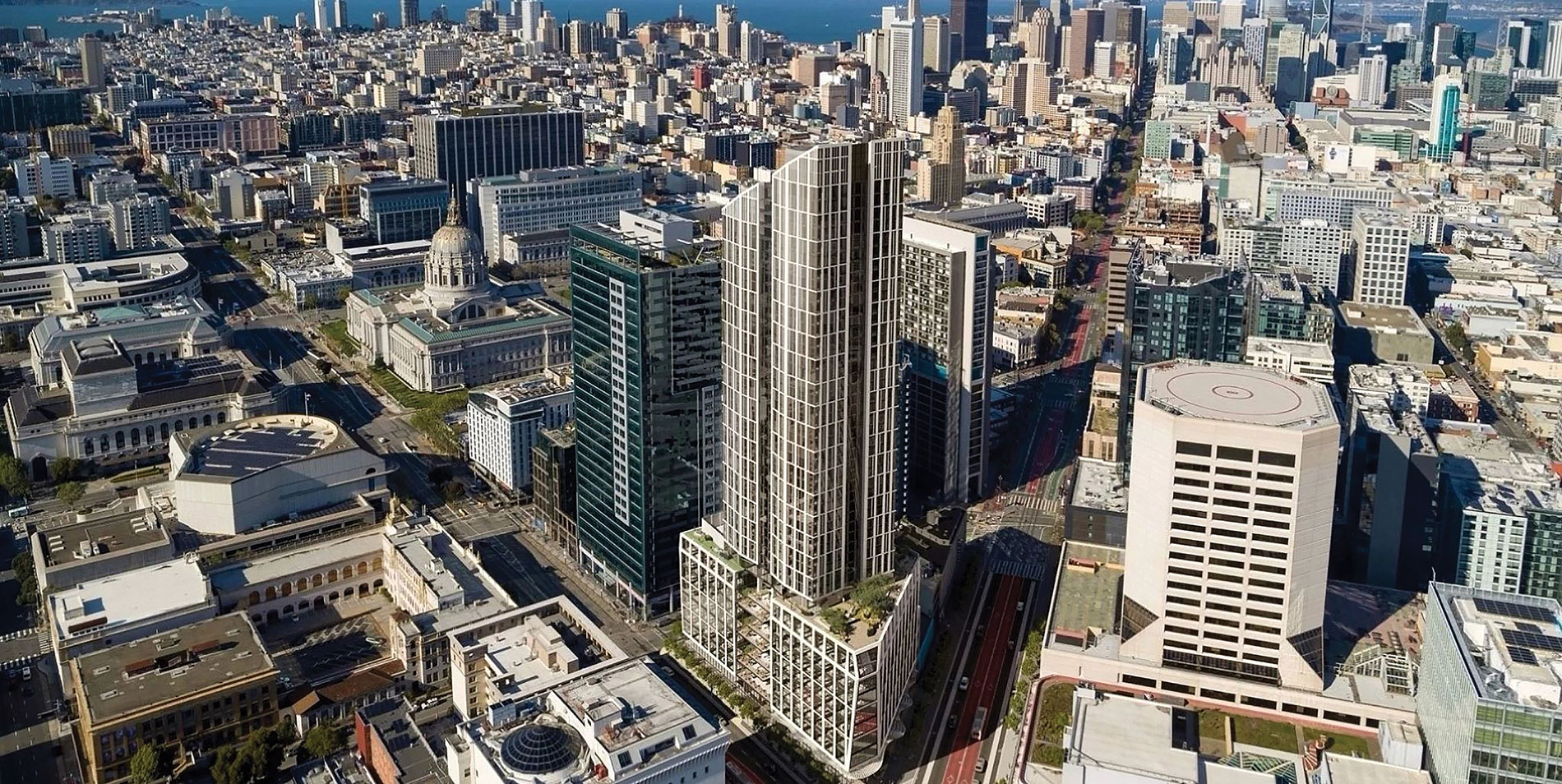 A skyscraper, 30 Van Ness, towers over a street corner in San Francisco. Image by Solomon Cordwell Buenz.