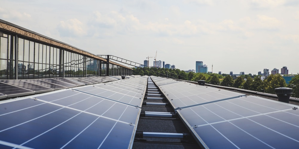 Rooftop solar panels. Photo by Jeroen van de Water on Unsplash
