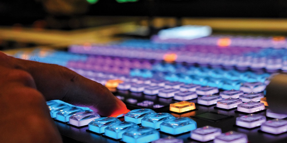 Finger pushing a lighted button