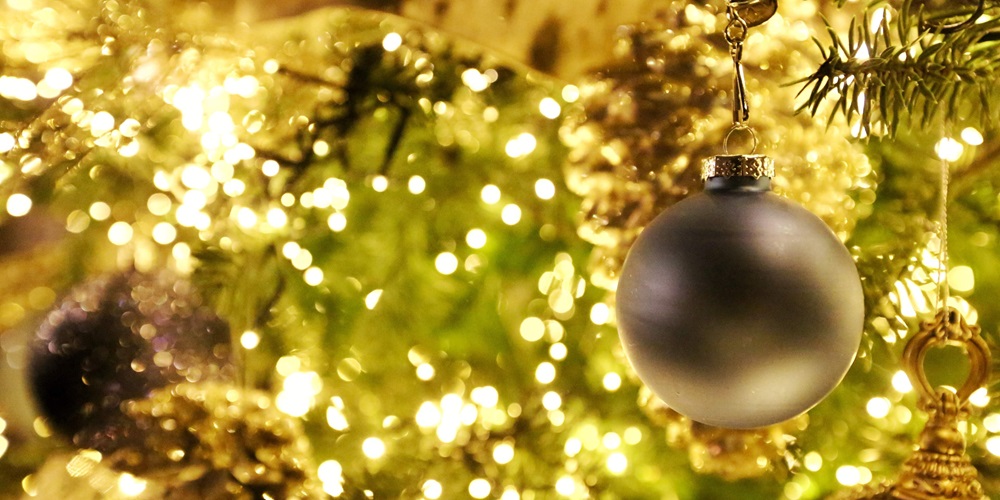 Close-up of a Christmas tree with lights (slightly unfocused) and decorations