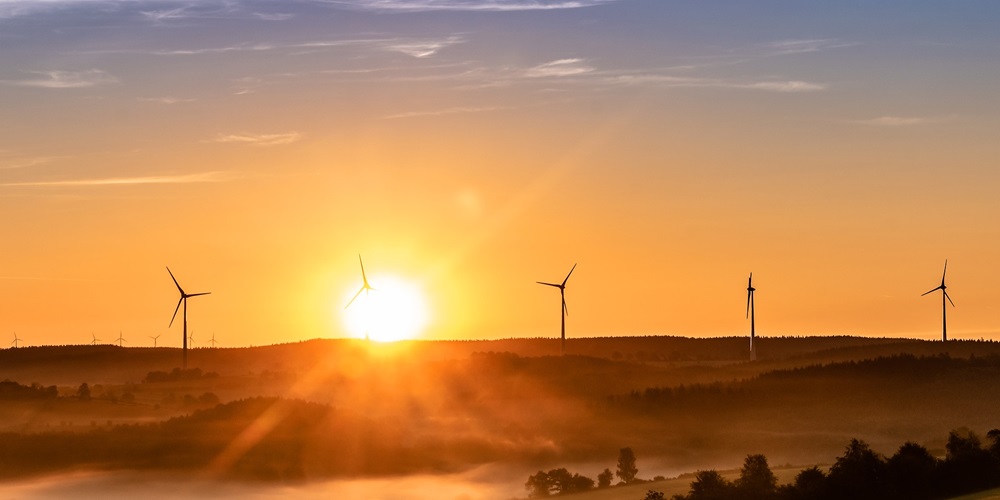 Wind power sunrise wind turbines Image by Myriam Zilles from Pixabay