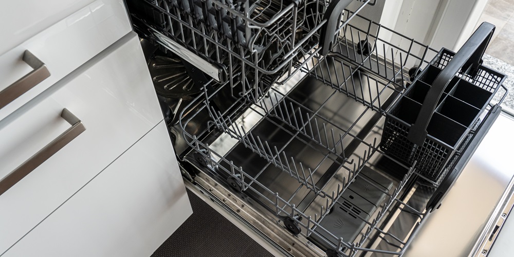 A dishwasher sits opened and empty