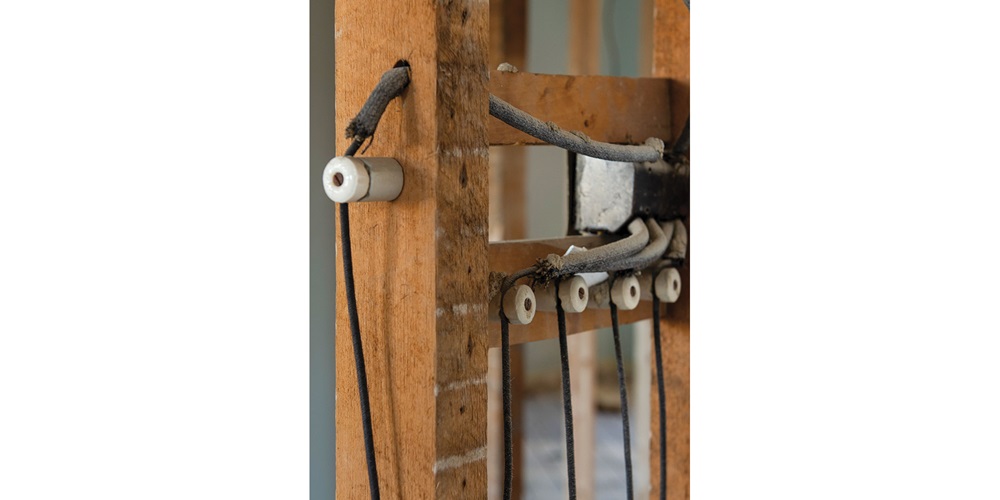 Knob-and-tube wiring on a residential renovation site | Shutterstock / Alessandro Cancian