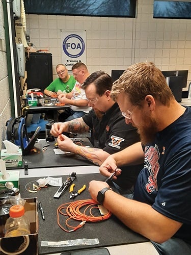 Cut From the Same Cloth: Electrical workers are fiber optic technicians