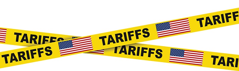 yellow tape with american flags and tariffs written on it