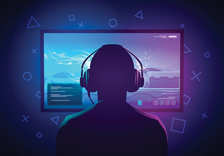 person looking at a screen wearing headphones