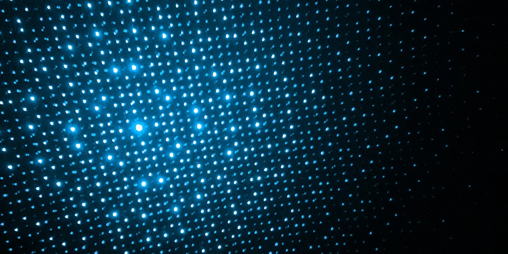 Dots of light illustrating quantum dot LED lighting. Photo by Aron Visuals on Unsplash.