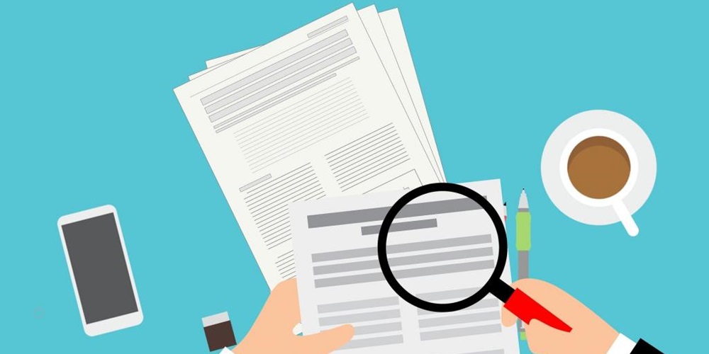 Illustration of hands holding a magnifying glass over documents. Coffee, a pen, and a phone are also on the blue surface. Image by https://freeimagesandillustrations.blogspot.com/2019/10/illustrations-of-audit-report.html.