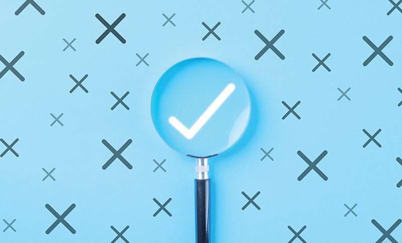 magnifying glass with checkmark
