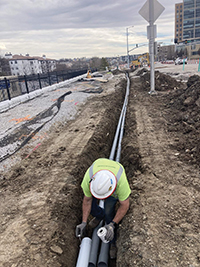 man working on underground ducts