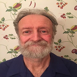 Bill-Atkinson-edited A man, William Atkinson, smiles in front of fruit-patterned wallpaper. Image by William Atkinson.