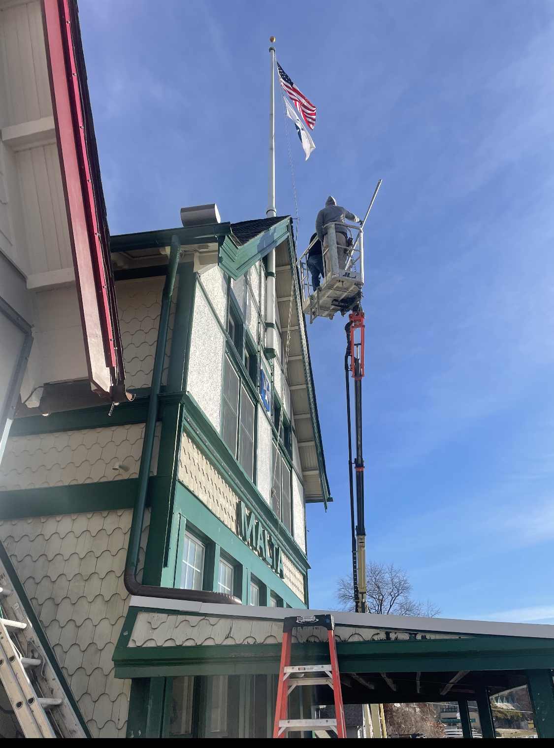 A variety of lifts had to be used to install new lighting for Philadelphia’s Boathouse Row due to the narrow grassy spaces between the houses. Photo courtesy of Eagle Industrial Electric. 