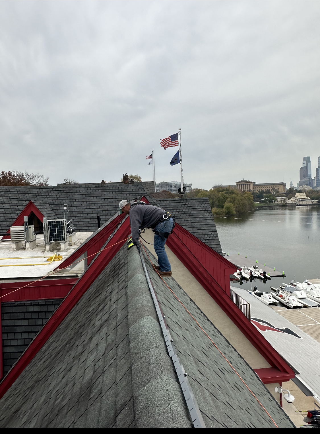 An Eagle Industrial Electric employee installs new lighting on one of the steep-pitched roofs of Philadelphia’s iconic and historic Boathouse Row. Photo courtesy of Eagle Industrial Electric. 