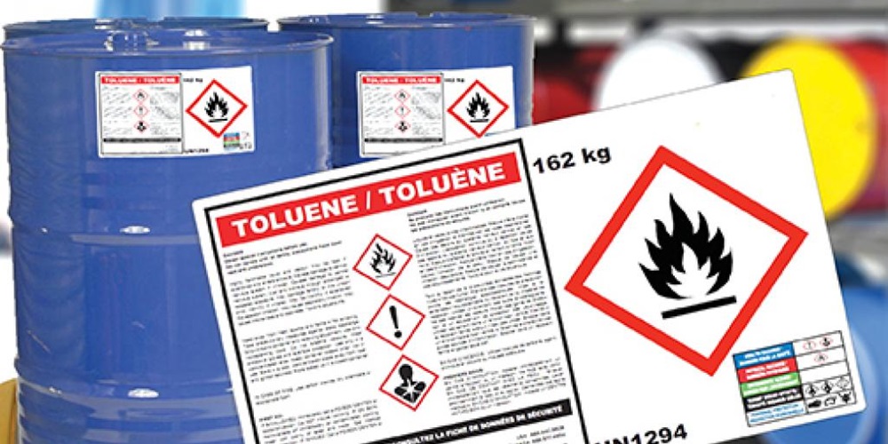 Blue cans labeled with a flame hazard sign. Image by CILS.