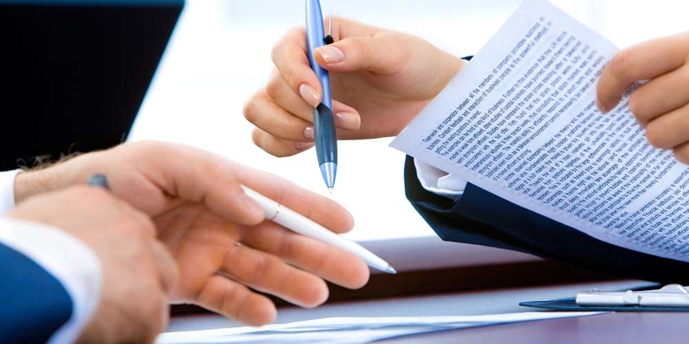 people signing a contract