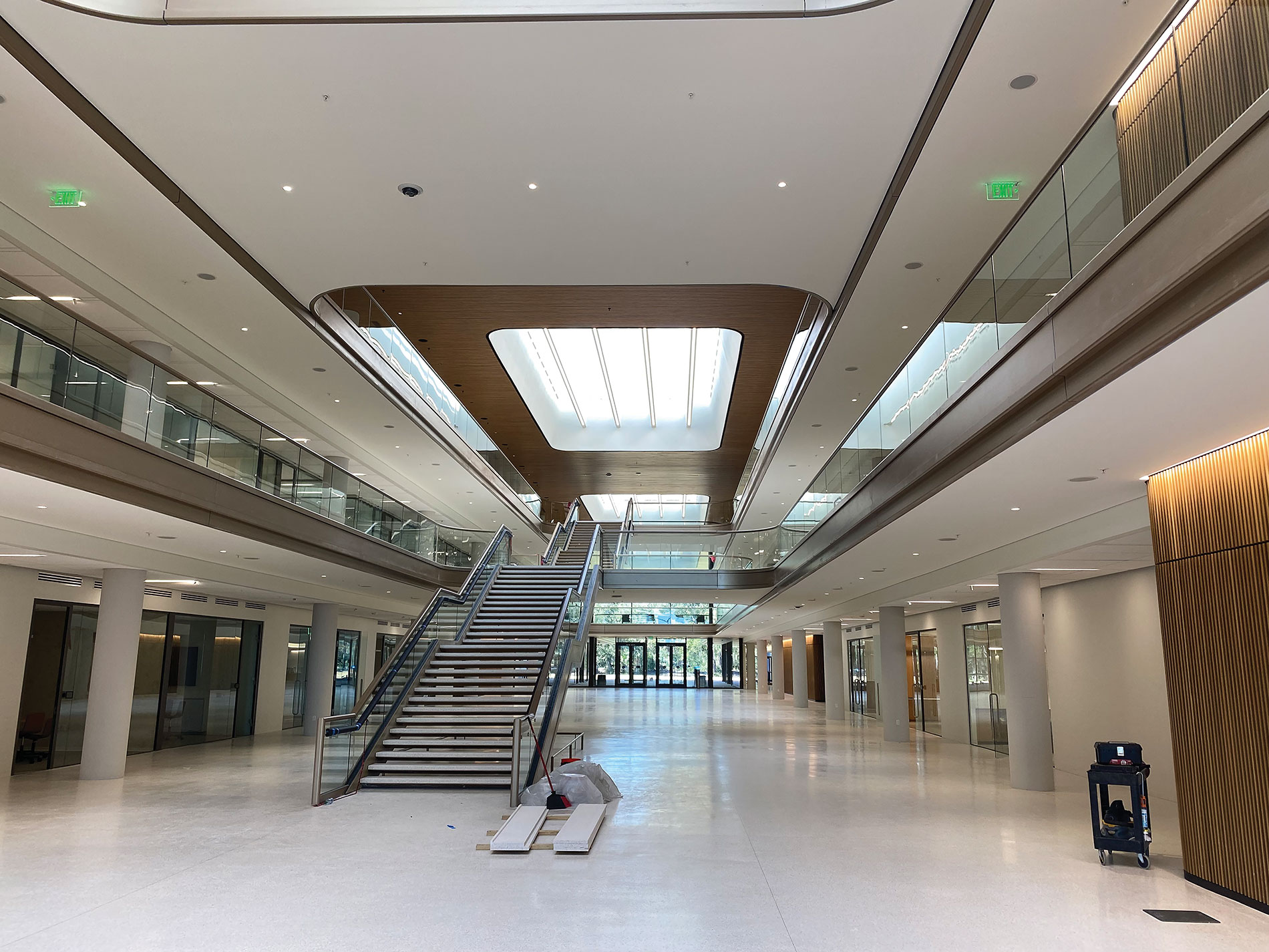 Atrium with stairs, skylights and wood paneling. Image by Miller Electric.