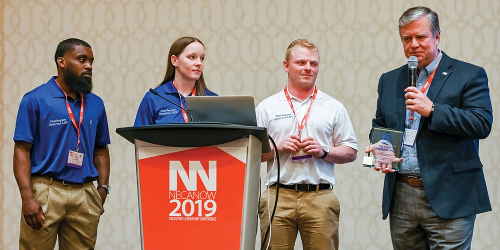 eal EC firm. Electri executive director Joey Shorter, Ph.D., presents the award. Photo Credit: NECA