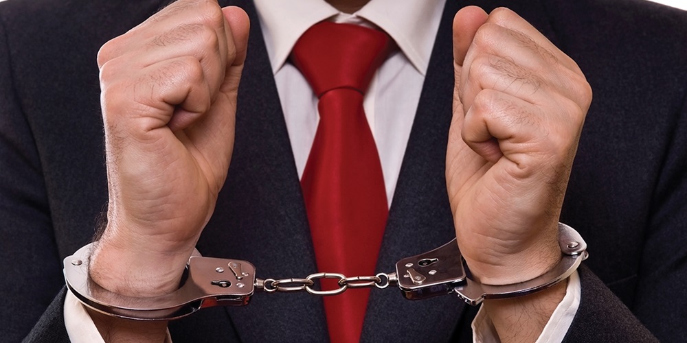 handcuffs_arrested_crook_criminaliStock_000005721341_Large.jpg