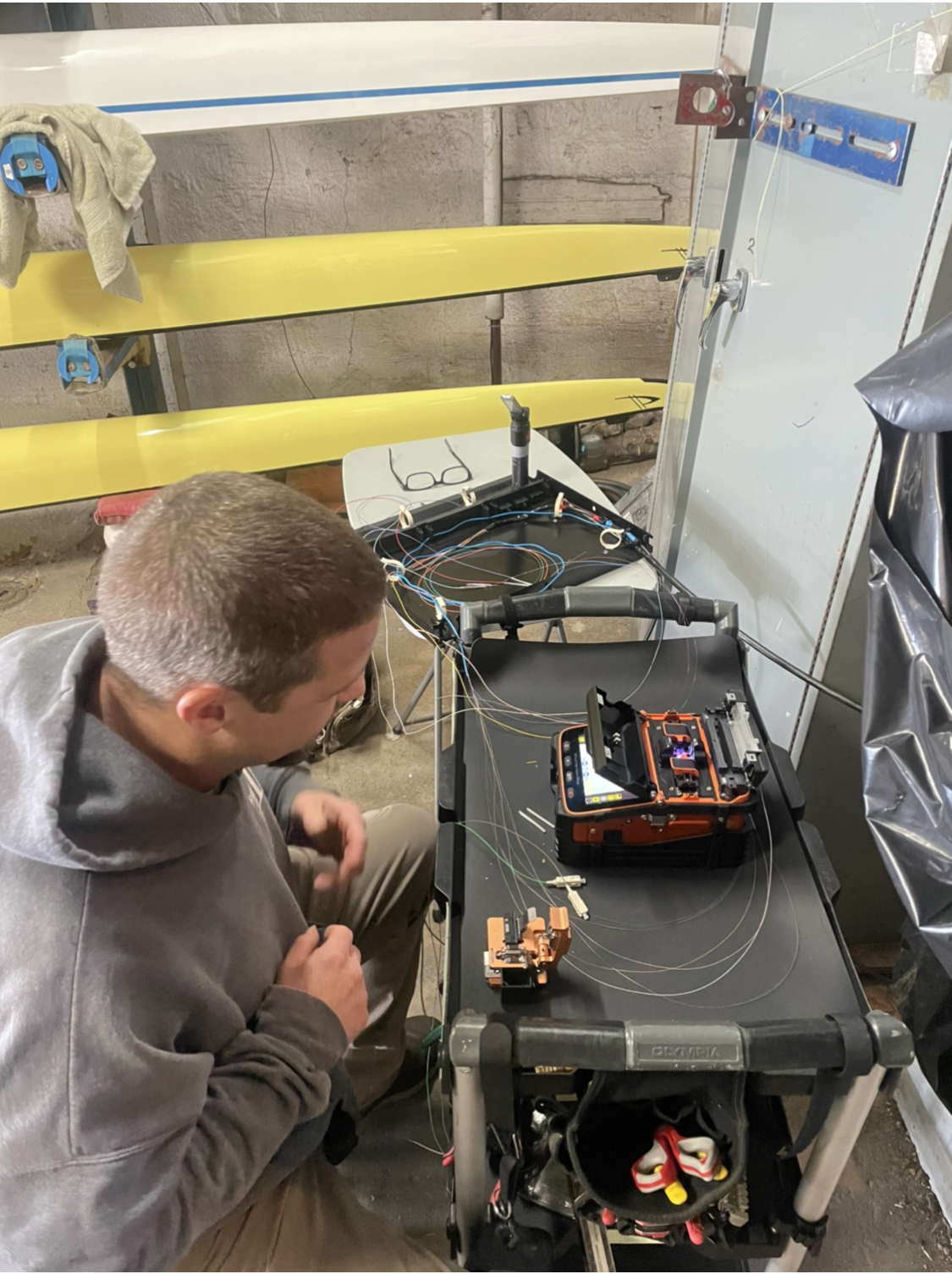 An Eagle Industrial Electric employee splices fiber optic cable used for connecting and programming the lights of Philadelphia’s Boathouse Row. Photo supplied by Eagle Industrial Electric. 