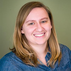 A woman, Hannah Fullmer, smiles in front of a green background.