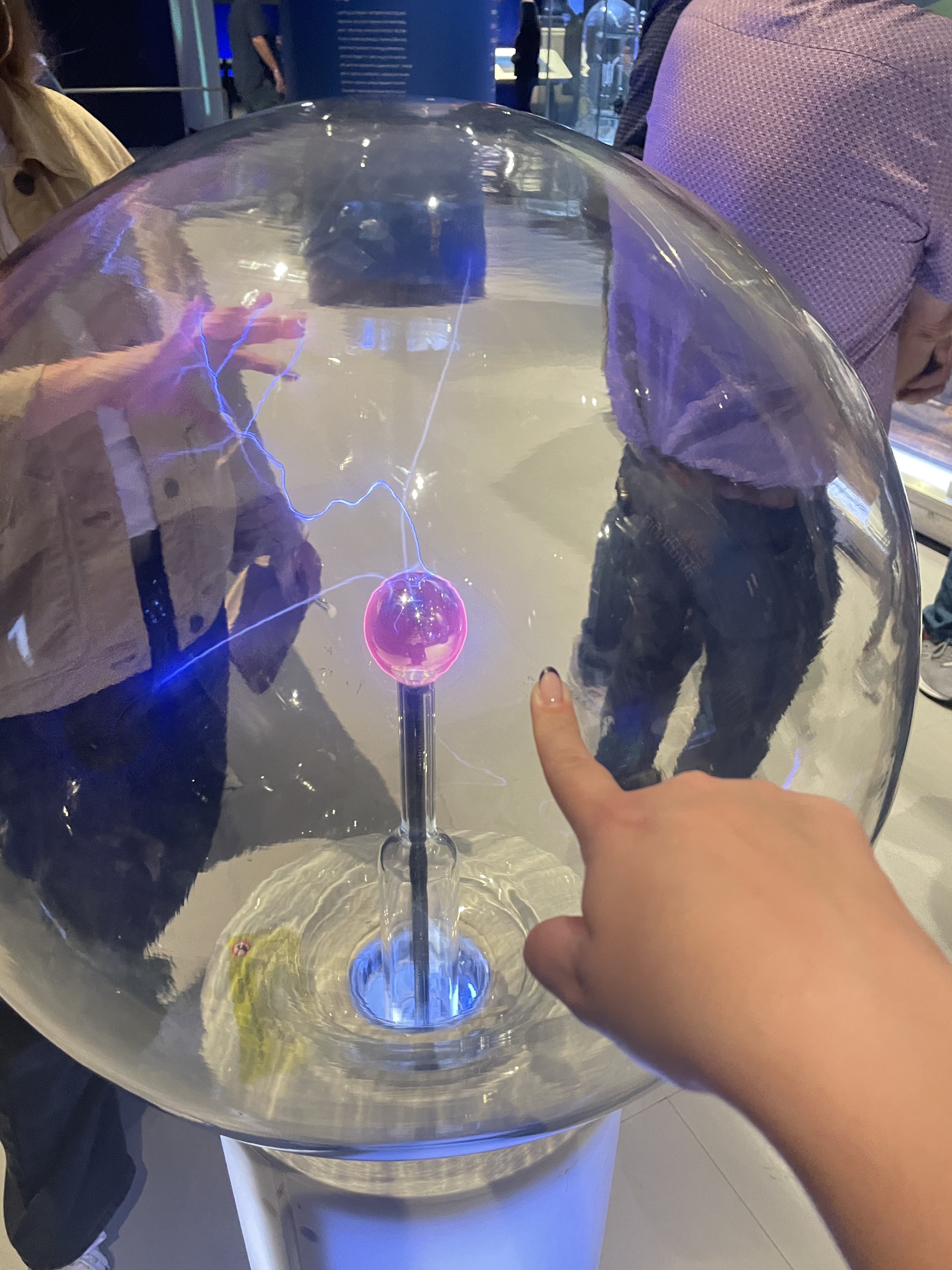 Guests experiment with static electricity at the Griffin Museum’s physics exhibit.