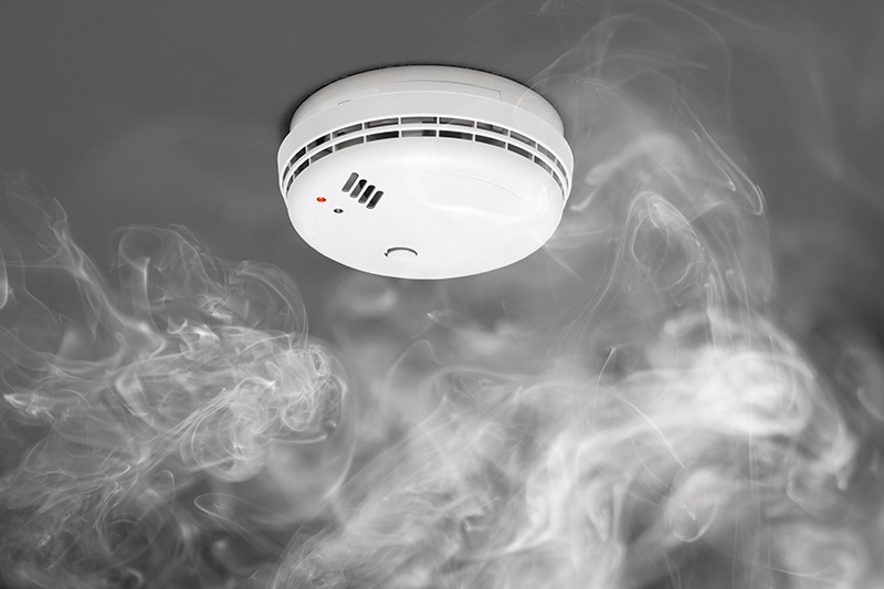smoke detector with smoke around it