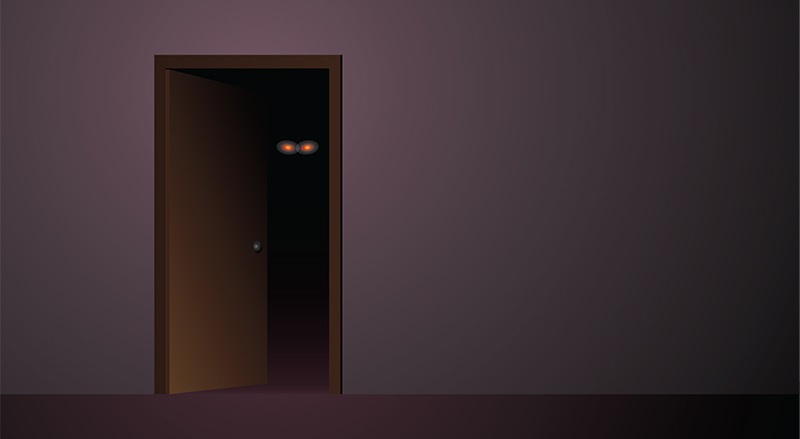 two red eyes from behind a door