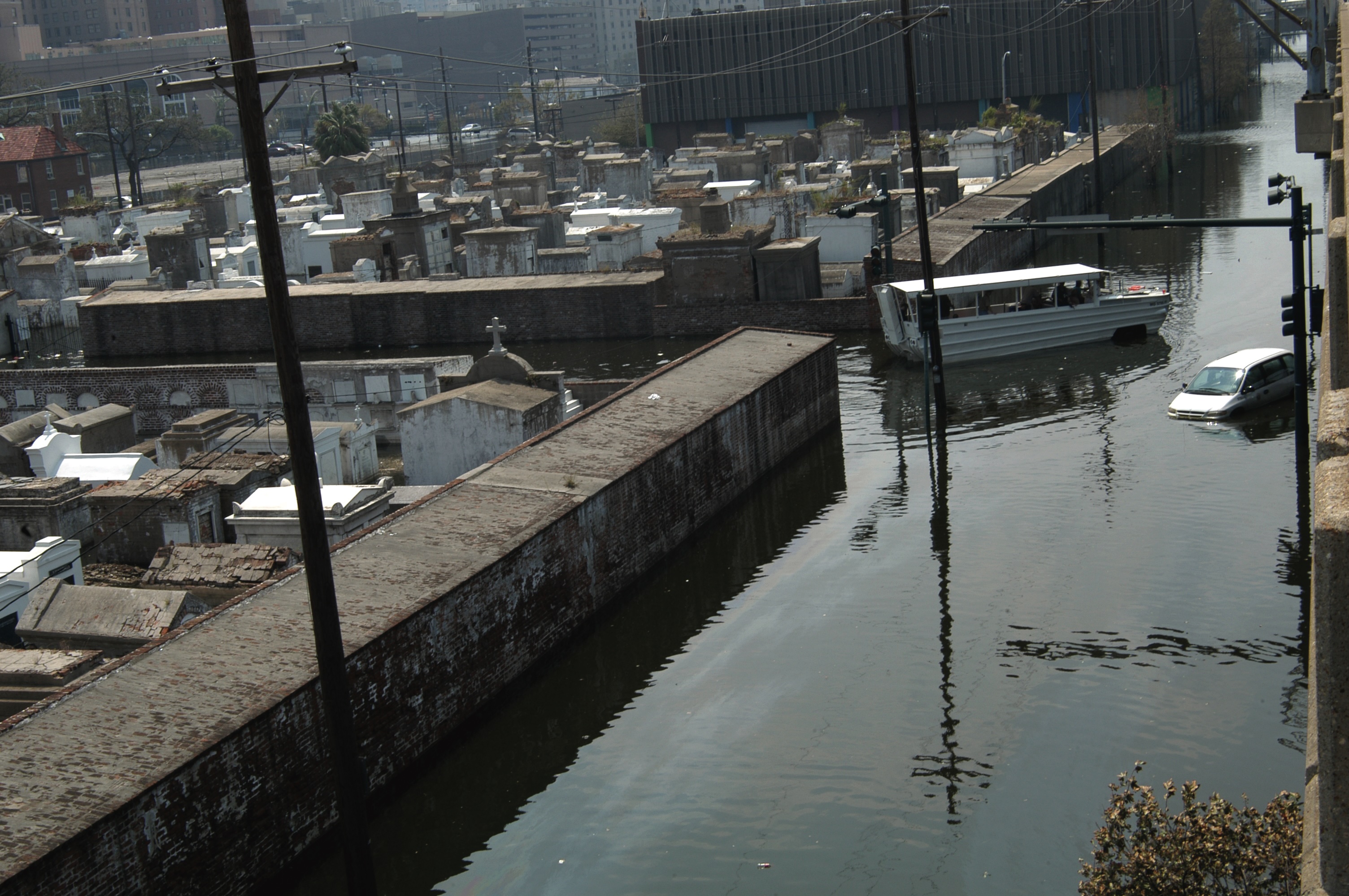 New Orleans, Sept. 5, 2005—An amphibian boat makes its way past one of the city’s many cemeteries, looking for people left stranded by Hurricane Katrina.
