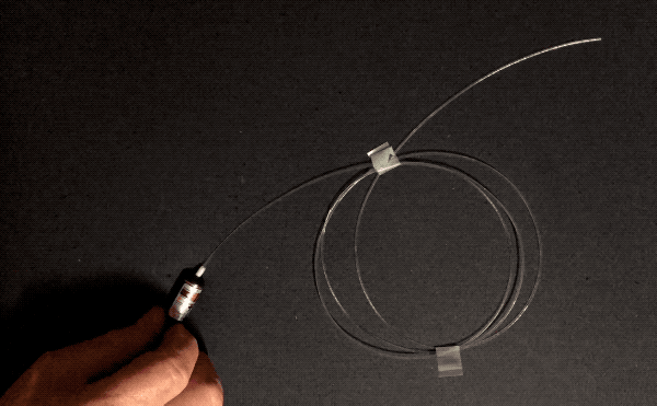 A laser pointer demonstrates how light is transmitted along a fiber optic cable