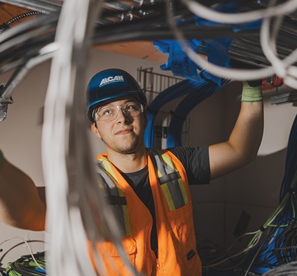An Alcan Electrical communications team member installs the core infrastructure for the Solid Waste Services Central Transfer Station project in Anchorage.