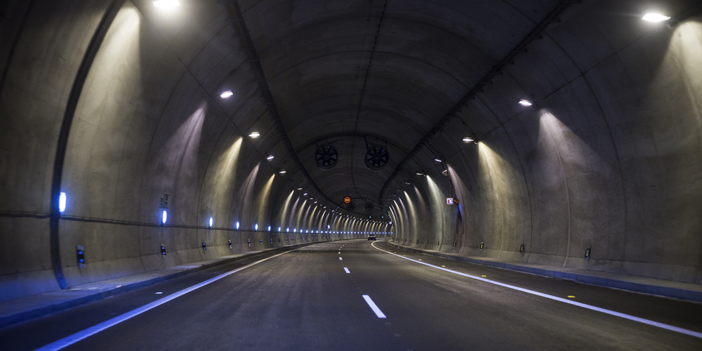 A street tunnel lined with blue and yellow lights. Image by Champion Fiberglass®.