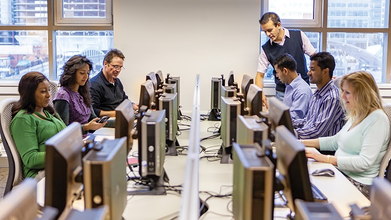 group of people in front of computers