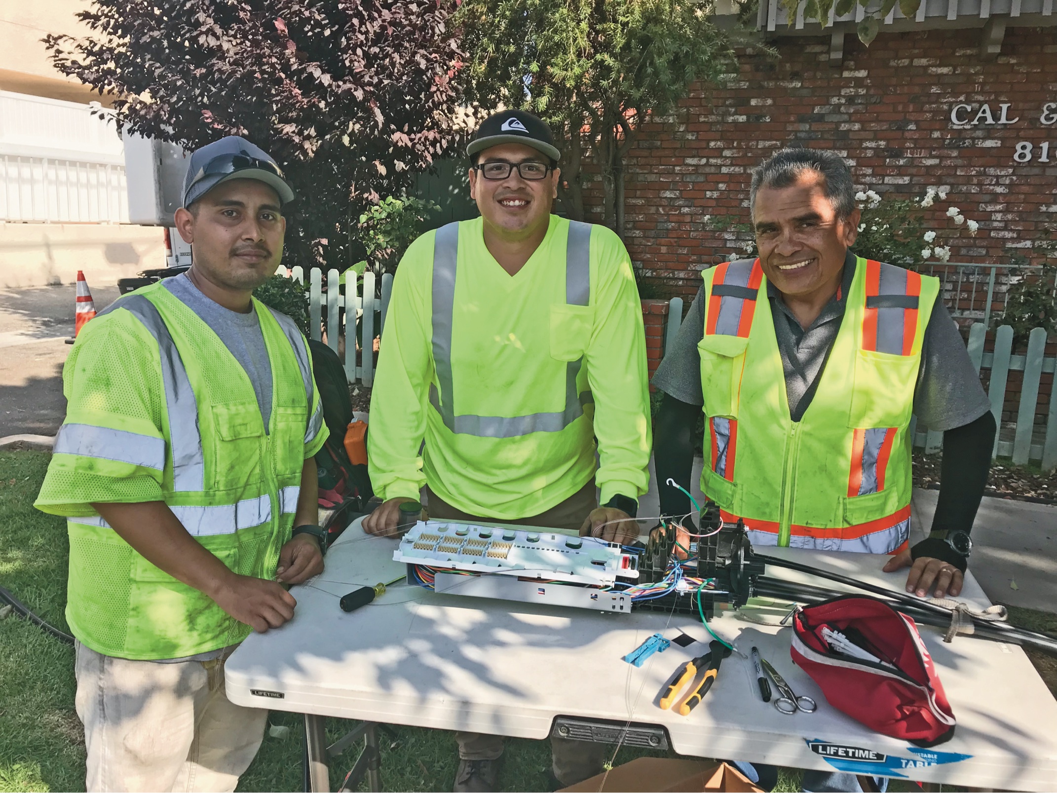 OJT at work: Learning to pull cables, becoming a splicer and OJT can be a family affair—the father training his sons to join him in the business. | Jim Hayes