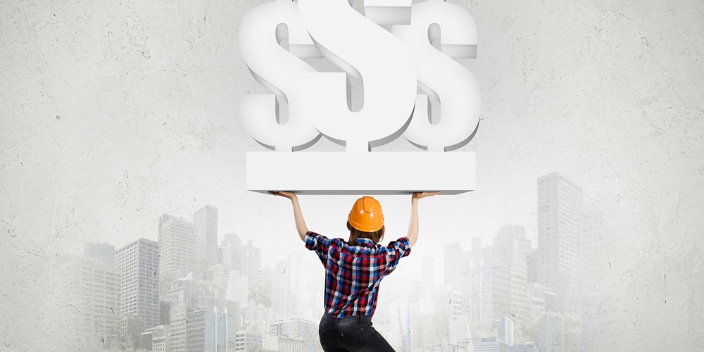 A worker holds up an illustration of dollar signs to a gray city. Image by stock.adobe.com / Sergey Nivens.