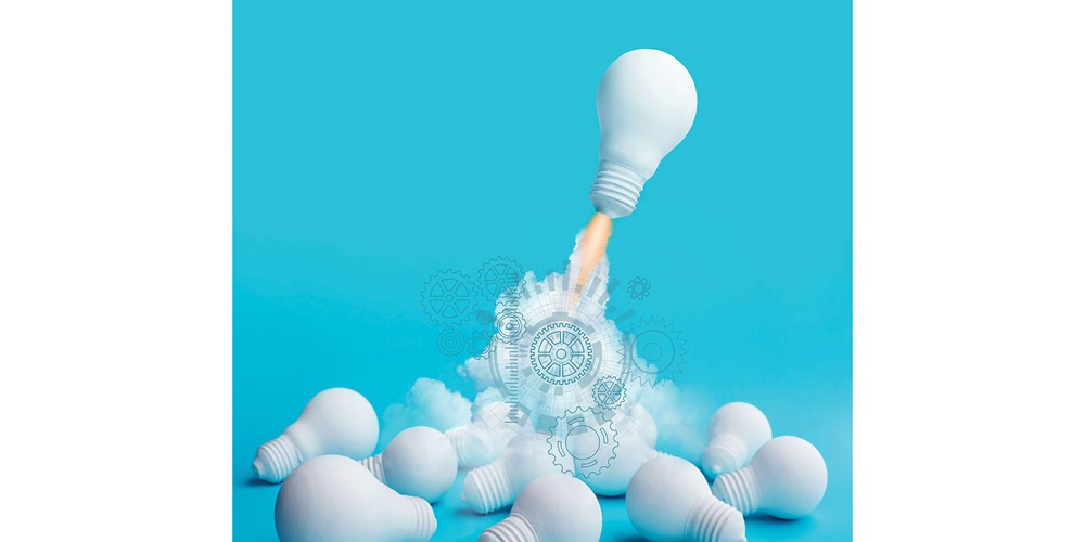 Illustration of a lightbulb rocketing away from a pile of lightbulbs. Image by Shutterstock / Artistdesign29 / HAKINMHAN.