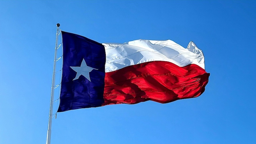 The Texas flag blowing in the wind.