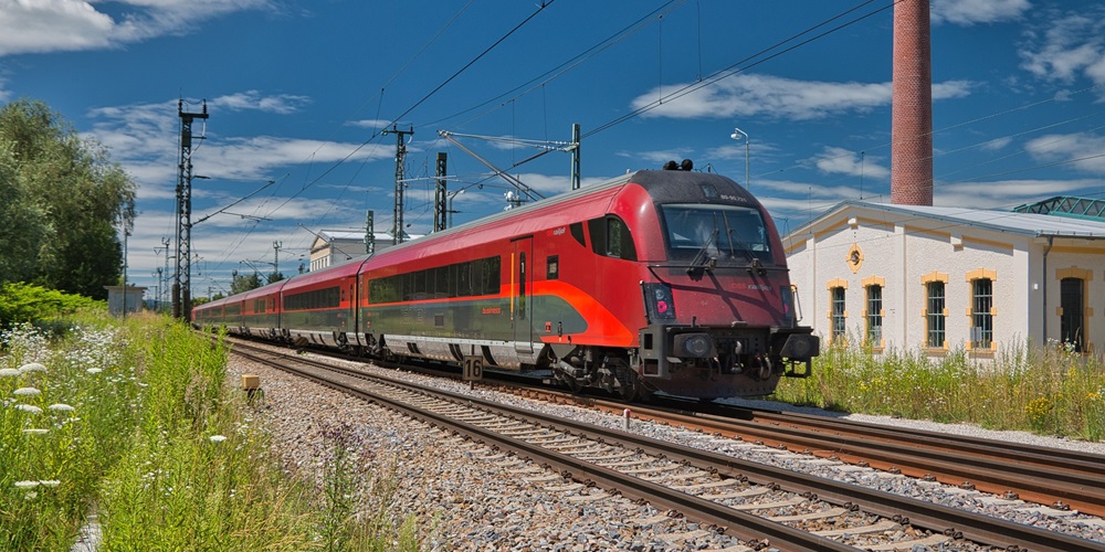red train on rail